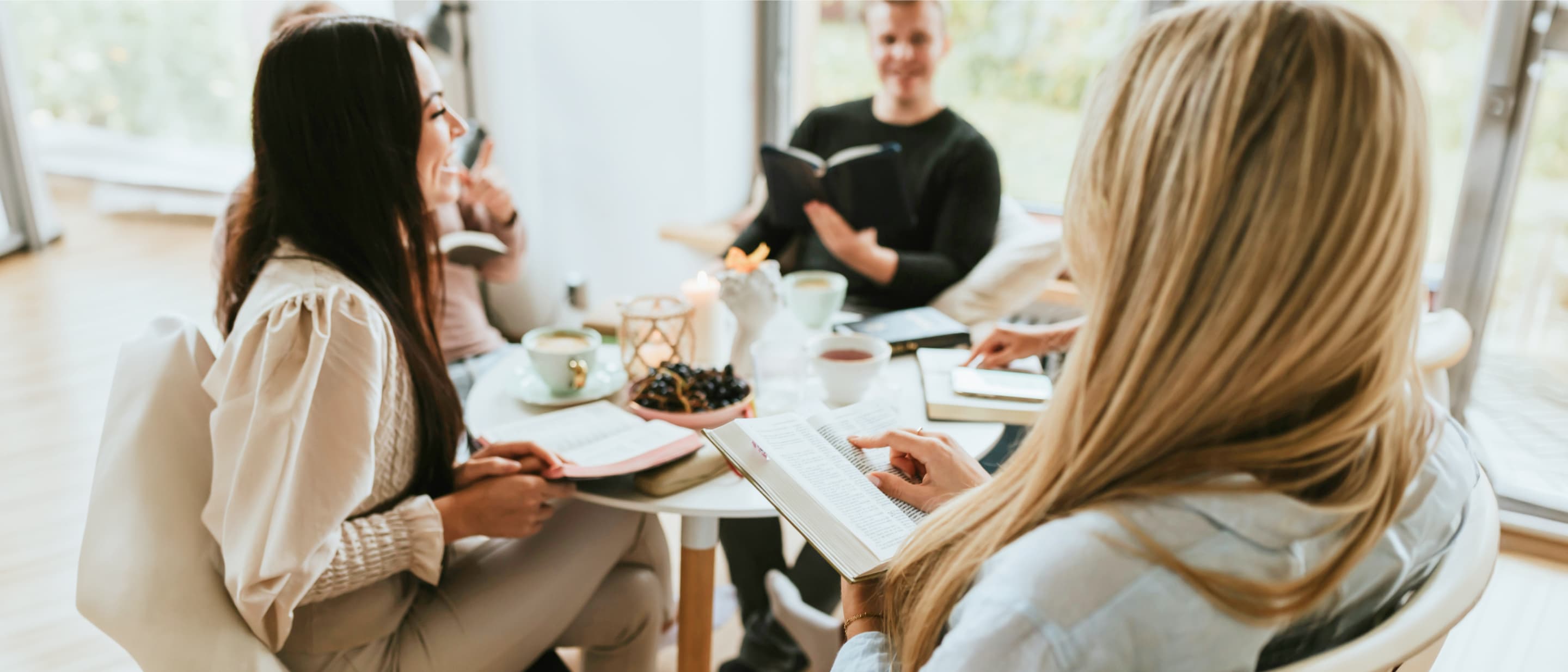 Women studying together in a warm, inviting setting
